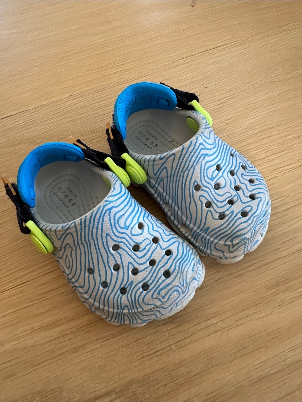 CROCS Kids White Clog Sandals with Blue Swirl and Neon Yellow Accents